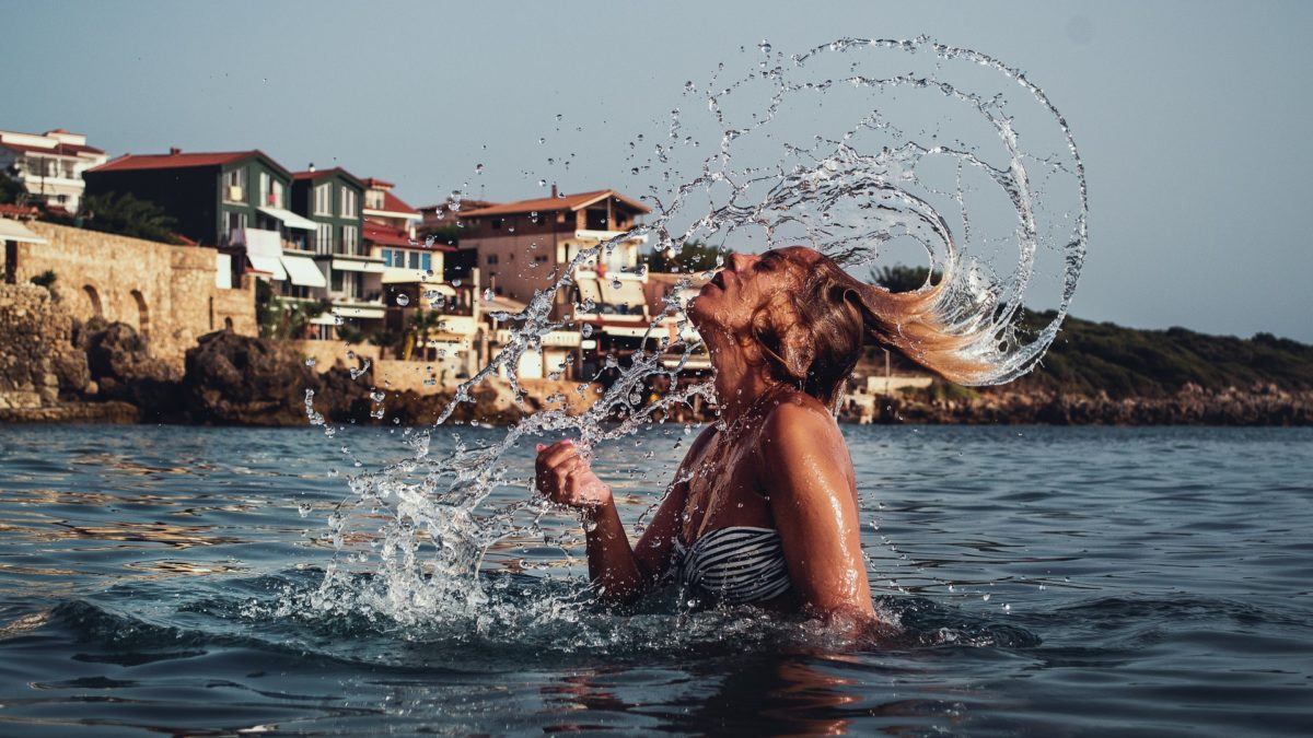 Flicking hair in the sea during summer
